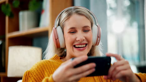 woman enjoying media on her smartphone with headphones
