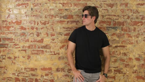 caucasian man taking off his sunglasses