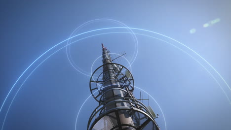 low angle view of 5g communication mast against blue sky sends signal waves into the world