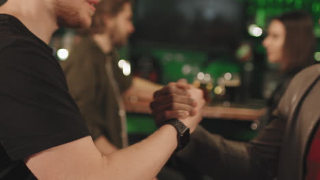 men greeting each other at bar