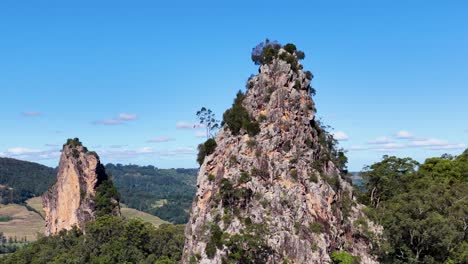 A serene 10-second video capturing the majestic Nimbin Rocks under clear blue skies in New South Wales, Australia