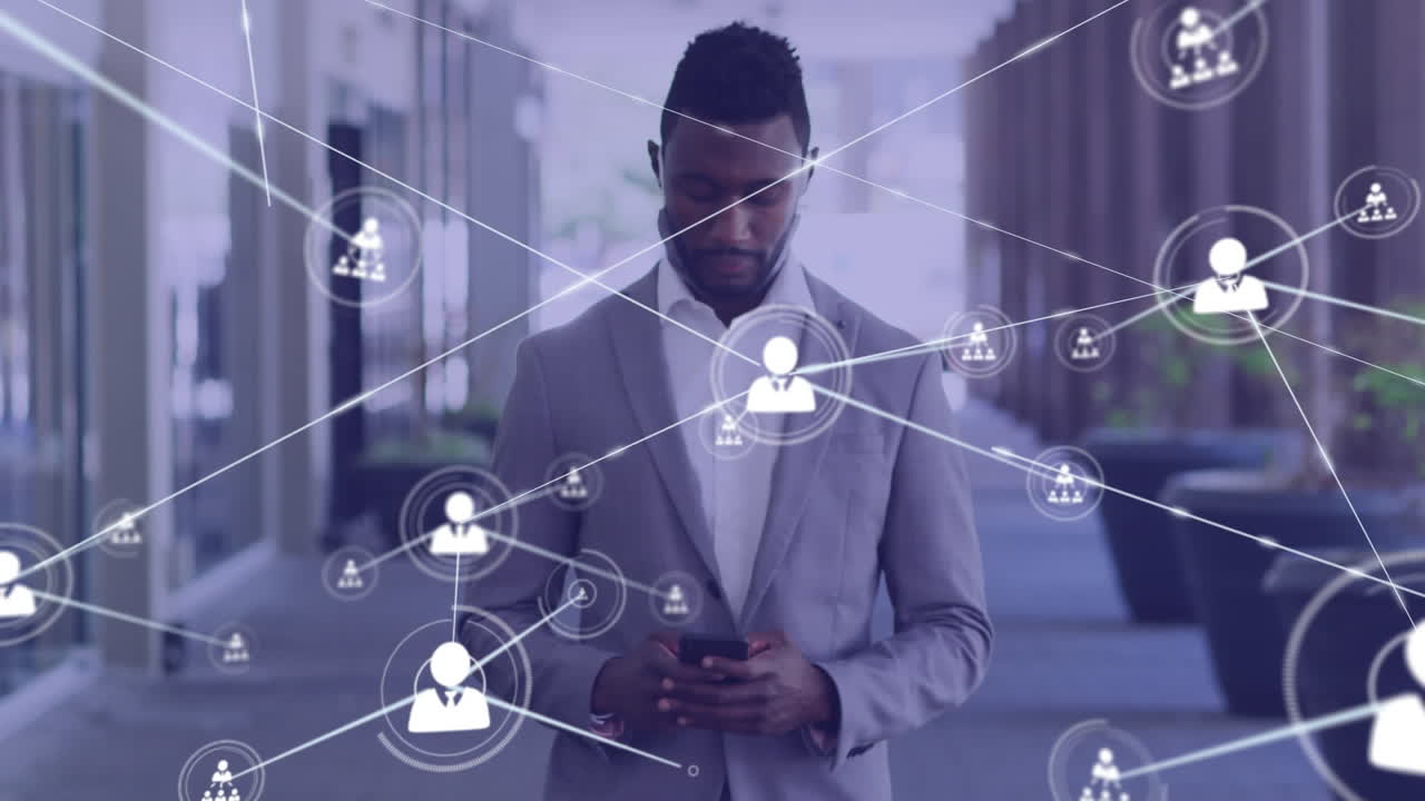 Animation of network of connected icons with businessman using smartphone walking in street
