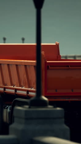 orange dump truck on a street