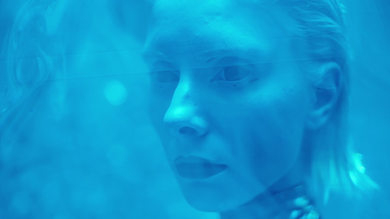 Alien Woman behind Blue Laser Light