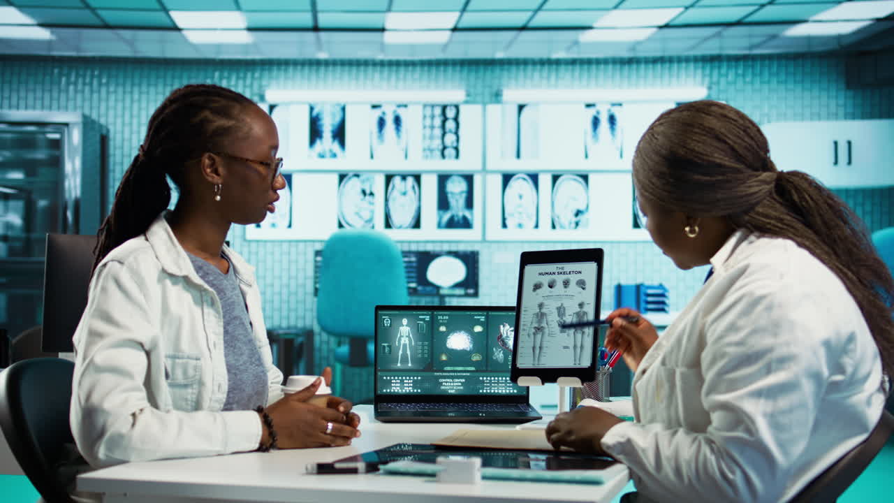 Health specialist advising a young patient during a clinic checkup visit