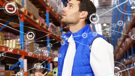 Animation-of-network-of-digital-icons-on-caucasian-male-supervisor-checking-stock-at-warehouse