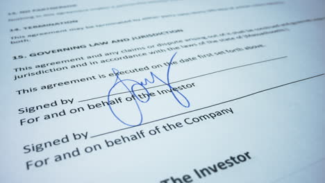 Business-woman-hand-signing-document-with-pen.-Female-signing-business-contract