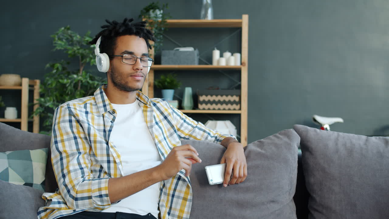 Man Listening to Music on Couch