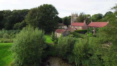 Aerial-video-footage-of-the-remains-of-Bolingbroke-Castle-a-13th-century-hexagonal-castle,-birthplace-of-the-future-King-Henry-IV,-with-adjacent-earthwork