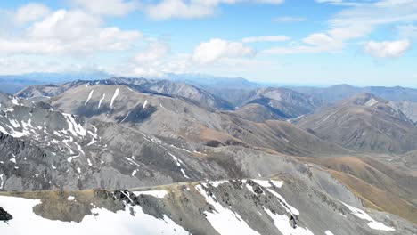 Endless-mountainscapes-with-residual-snow-on-sunny-spring-day-in-Canterbury,-New-Zealand