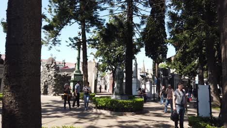 panoramic pan tourists visit la recoleta gothic cemetery at buenos aires argentina