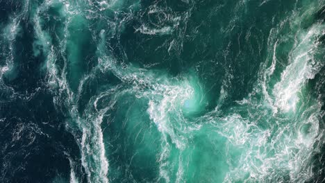 blue waves of water of the river and the sea meet each other during high tide and low tide.