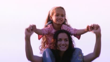 Mother-with-her-daughter-on-her-shoulder