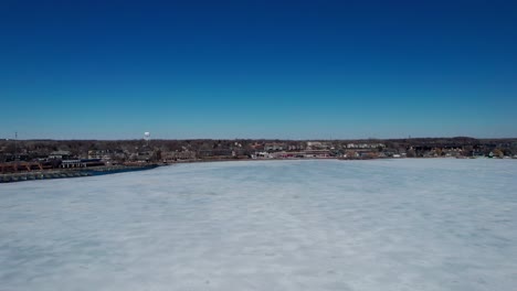 drone aerial view over frozen lake minnetonka