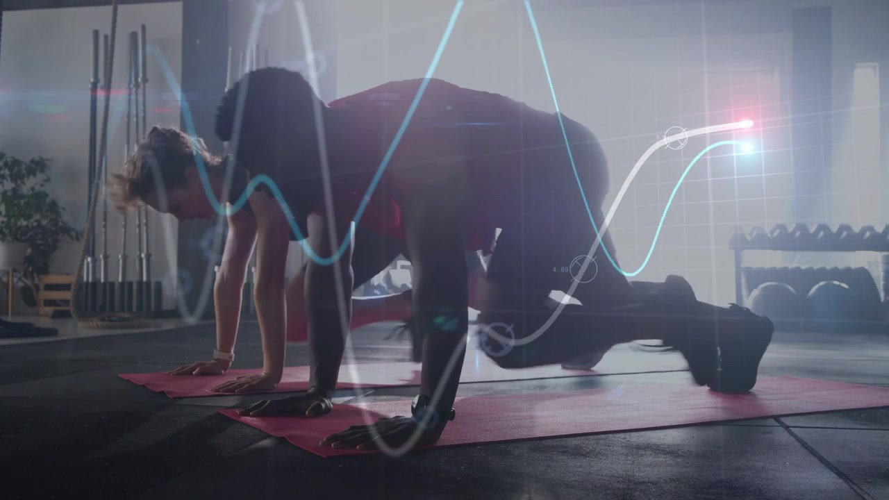 Gym duo starting plank on red mats, performing knee drives syncing to waveform pulsing for core