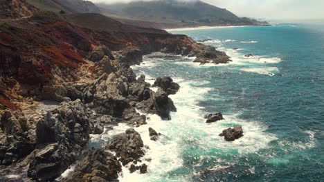 Drone-aerial-flight-view-of-emerald-sea-on-the-Big-Sur-Coastline