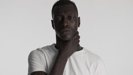 Burdened-African-american-man-on-grey-background.