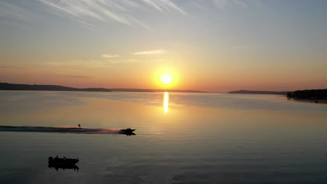 Gorgeous-golden-hour-drone-shot-over-Lake-Geneva,-Wisconsin-during-sunset