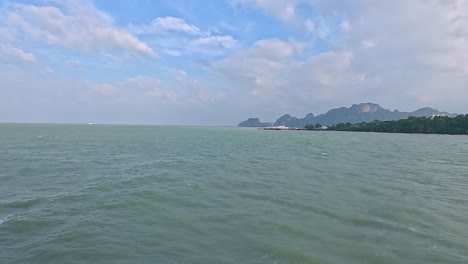 a tranquil 35-second video capturing the expansive sea and distant mountains of koh samui under a partly cloudy sky