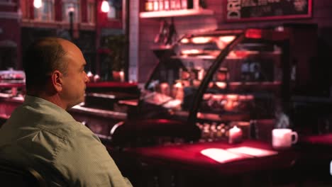 middle-aged white male drinking coffee in coffee shop