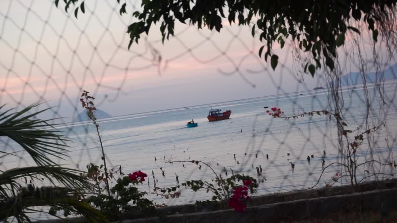 Cinematic sequence of two boats in the sunrise
