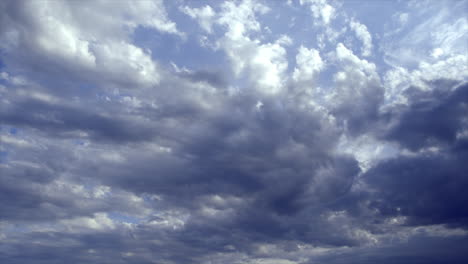 Time-lapse:-White-clouds-moving-across-a-blue-sky