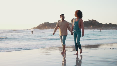 Happy,-interracial-couple-and-walking-at-beach