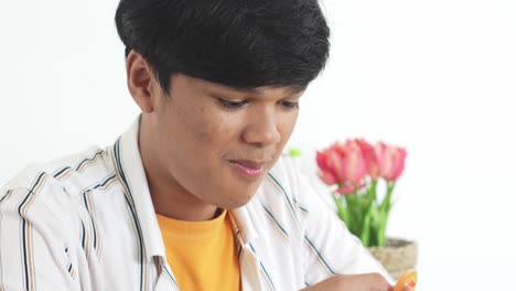 young man enjoying a healthy snack