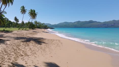 Foamy-Waves-and-Turquoise-Waters-of-Playa-Colorada-in-Las-Galeras,-Dominican-Republic-Tracking-Shot