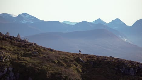 person running up a mountain