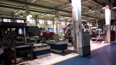 factory interior with machinery and workers