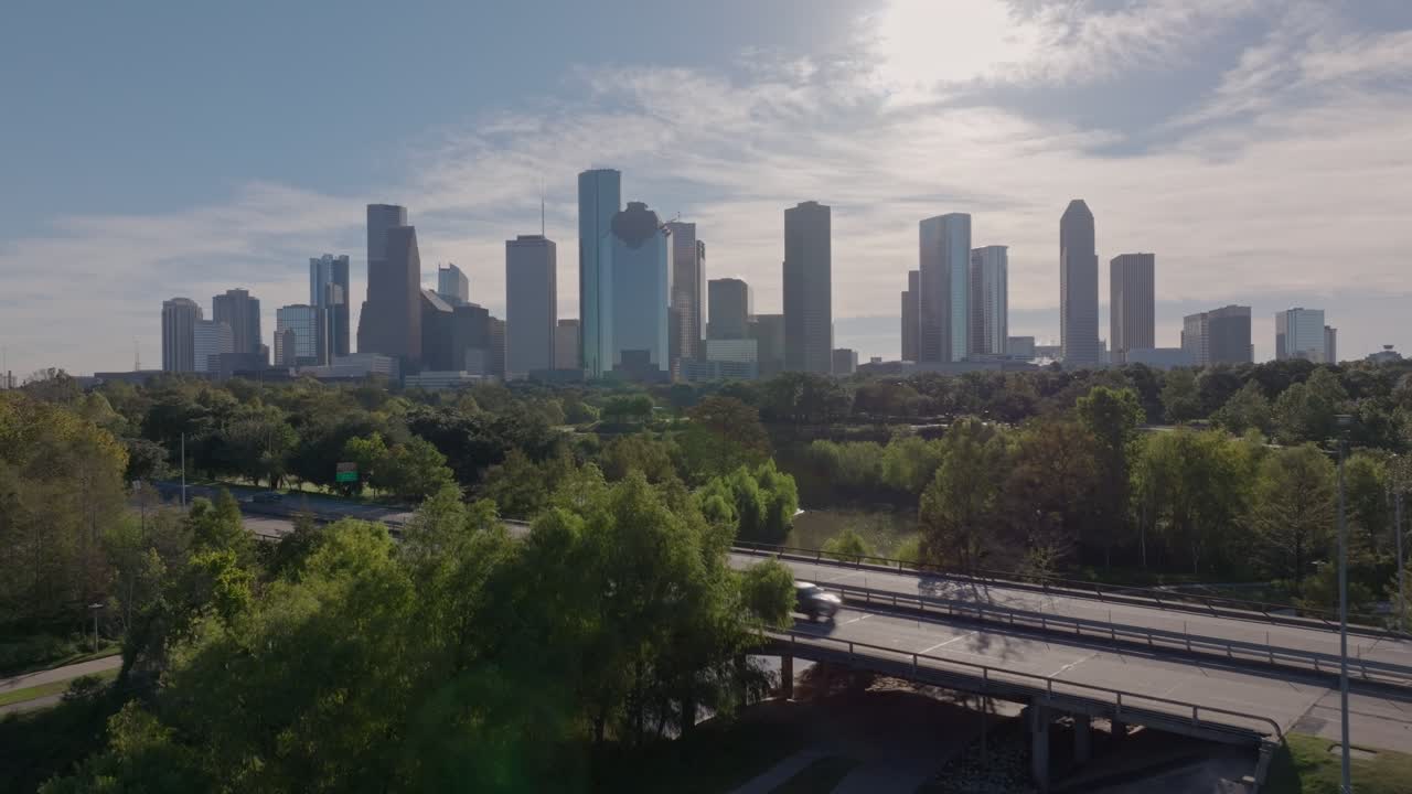 Houston City Skyline with Urban Park and Bridge on a Sunny Day