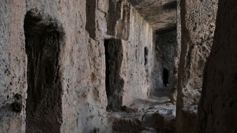 view of the outer walls of an ancient roman necropolis in anavargos paphos, cyprus