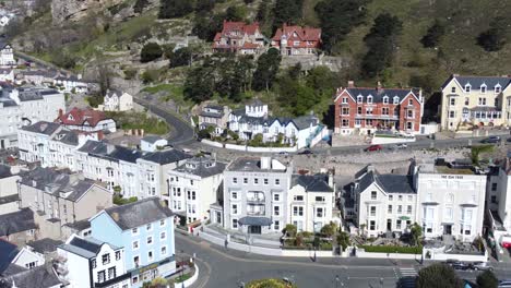 colourful llandudno seaside holiday town hotels against great orme mountain aerial view right orbit