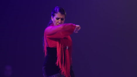 close up of woman dancing flamenco on stage. handheld