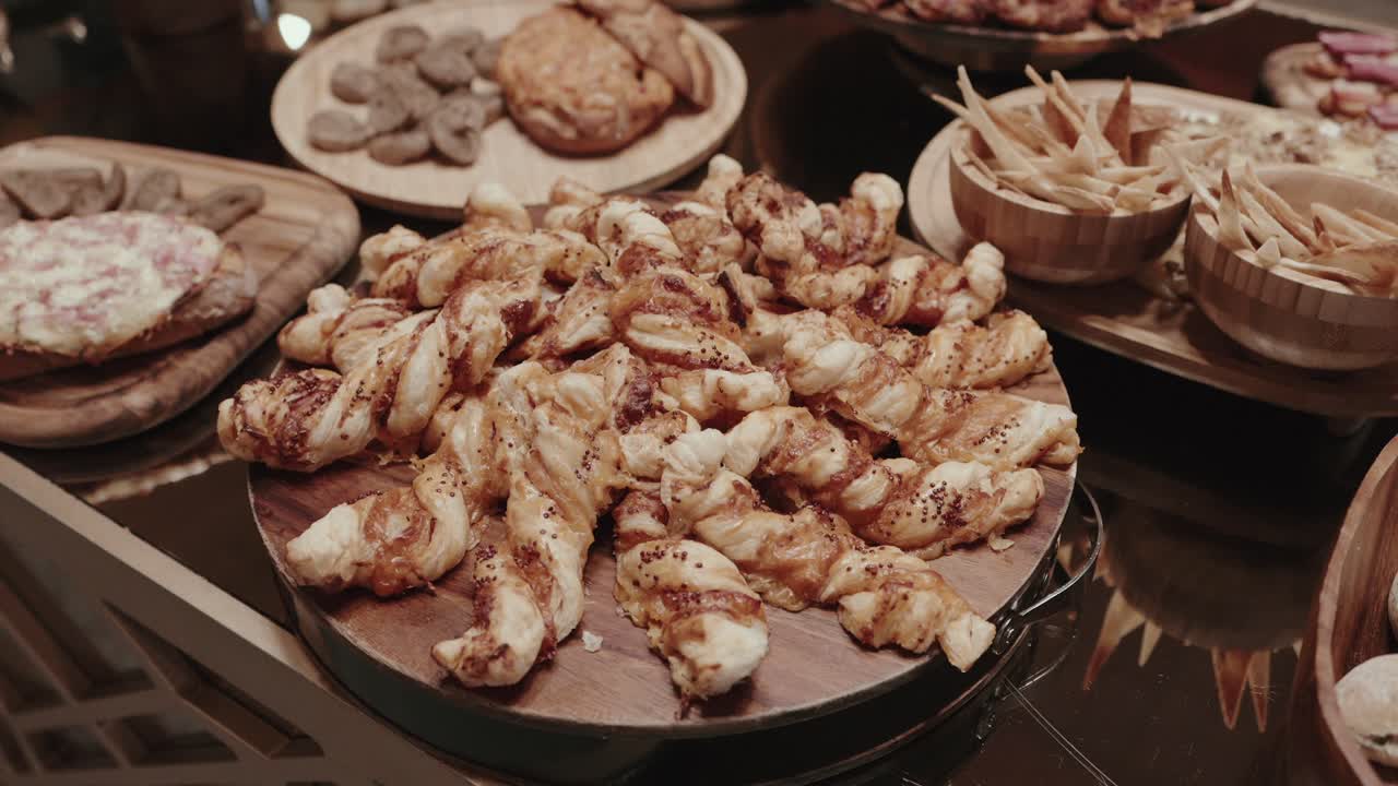flaky twisted pastries arranged for elegant buffet dining display