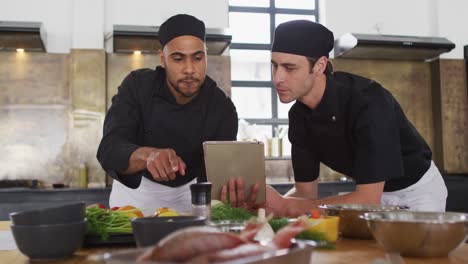 Diverse-group-of-chefs-preparing-dishes-and-smiling