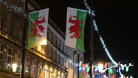 in the city centre of cardiff. the flags of wales at a christmas night
