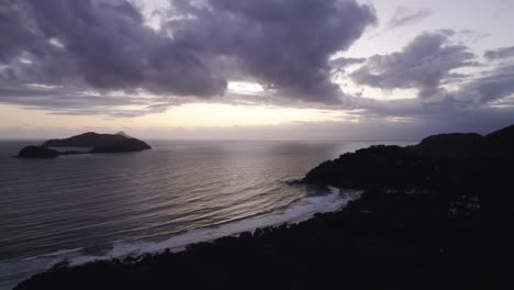 dramatic evening at the barra do sahy beach in sao sebastiao, brazil - aerial view