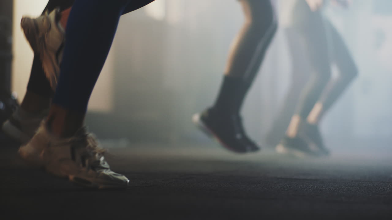 Group Jumping Jacks Exercise in Gym