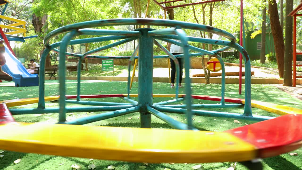 Playground roundabout spinning with no children