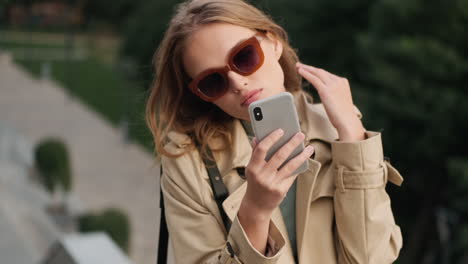 Caucasian-female-student-taking-selfies-outdoors.