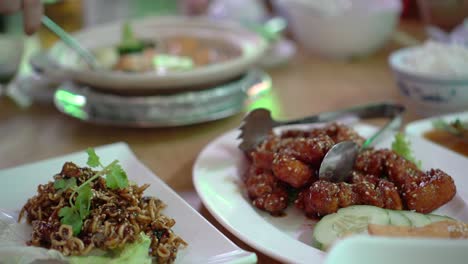 chinese round table meal in restaurant gungpao chickend and tofu clay pot