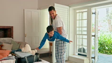 Father-playing-airplane-with-his-child