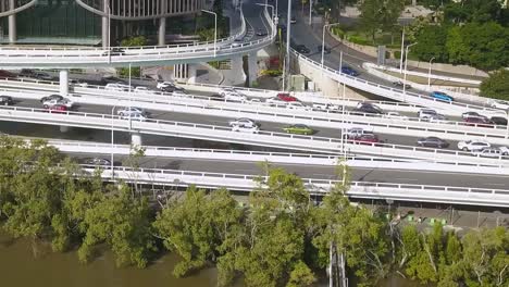 Cars-zoom-past-on-multi-level-highway-on-and-off-ramp-exchange-in-downtown-Brisbane