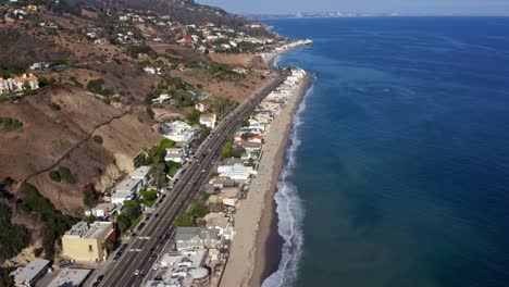 drone footage of the pch california as cars drive
