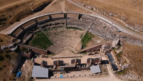 Aerial-view-of-a-Roman-era-theater,-showing-the-bleachers-and-the-scenary