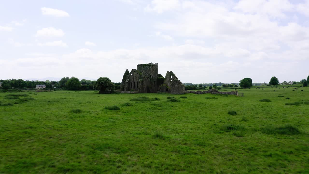 Drone pushing towards an abandoned castle in Europe.