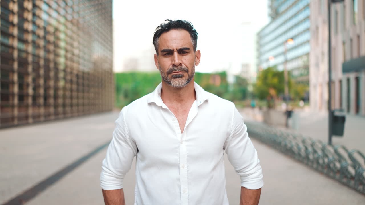 Serious Businessman with Arms Crossed Outdoors