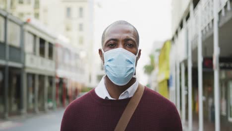 african american man on the go wearing coronavirus covid19 mask